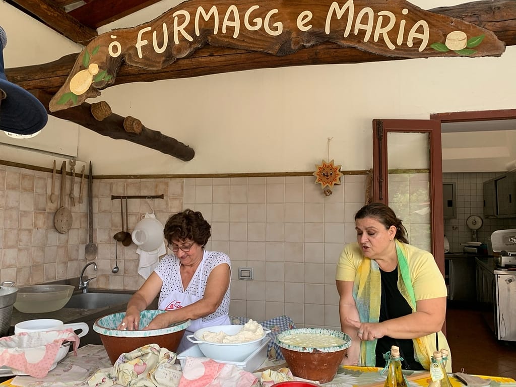 A woman demonstrates traditional mozzarella making during a cooking class on Italy’s Amalfi Coast.